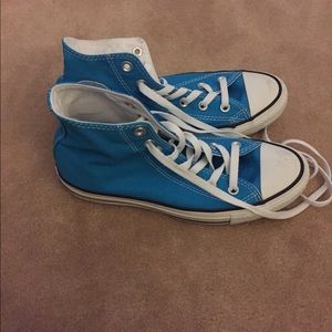 Light blue high tops converse